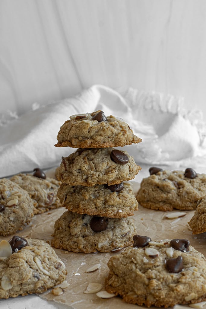 chocolate oatmeal cookies stacked with sliced almonds 